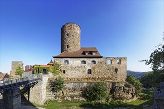 Castle ruin Thann castle with fortified defence tower and moat