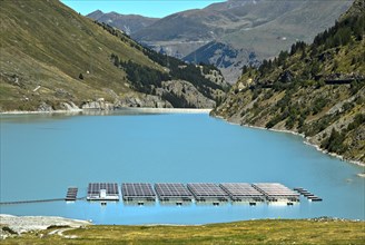 Solar panels floating on the mountain lake Lac des Toules