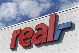 Logo of the supermarket chain Real