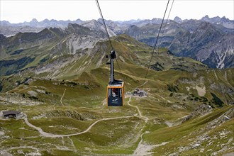 View of the Allgäu Alps and the cabin of the summit cable car to the Nebelhorn