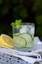 Cucumber water in glass and lemon