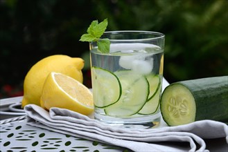 Cucumber water in glass and lemon