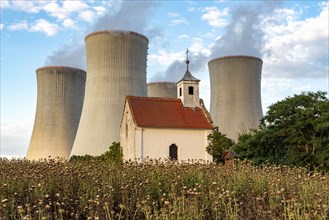 Old abandoned chapel and cooling towers of Dukovany Nuclear Power Station
