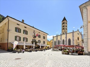 Village square with collegiate church of San Vittore Mauro