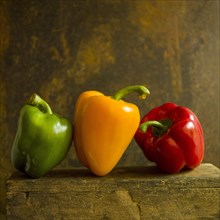 Bell peppers on a brown background