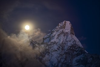 Ama Dablam 6812 m in the evening light with moon