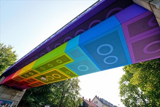 The Lego Bridge 2.0 or Rainbow Bridge is a concrete beam bridge over Dahler Strasse in Wuppertal-Langerfeld. Developed by graffiti and streetart artist Martin Heuwold