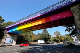 The Lego Bridge 2.0 or Rainbow Bridge is a concrete beam bridge over Dahler Strasse in Wuppertal-Langerfeld. Developed by graffiti and streetart artist Martin Heuwold