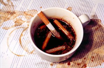 Cigarettes in a coffee cup