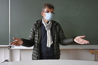 Teacher with thick winter jacket