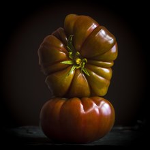 Two black Crimean tomatoes