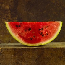 Close-up of watermelon Slice on a brown background