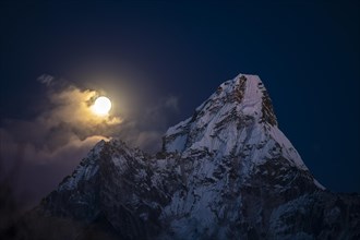 Ama Dablam 6812 m in the evening light with moon