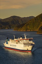 Arriving ferry from the North Island at sunset