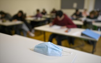 Face mask on student's desk