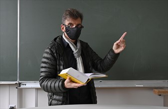 Teacher with thick winter jacket