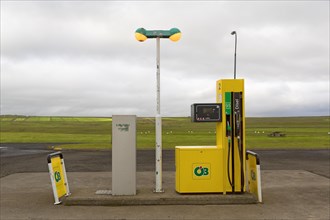 Small remote petrol station with yellow fuel pump