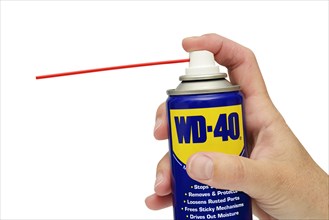 WD 40 spray lubricant can against a white background