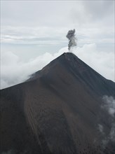 Smoke spitting volcano