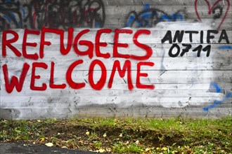 Graffiti REFUGEES WELCOME refugees refugees welcome