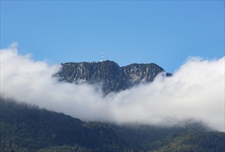 Band of clouds around mountain peak Katrin