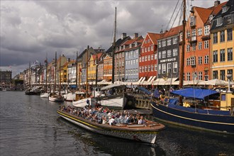 Excursion boat at the busy Nyhavn Canal