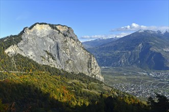 Steep rock face on the south side Ardeve summit above the village of Leytron in the Rhone valley