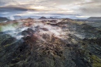 Aerial view of the steaming Krafla lava field with colorful rocks