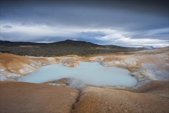 Turquoise lake in the lava river Leihrnjukur in the Krafla