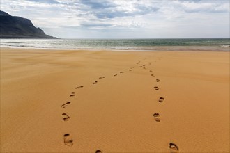 Two footprints in the sand