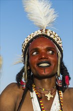 Wodaabe-Bororo man with his face painted at the annual Gerewol festival