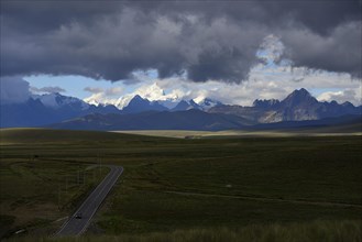 Mountain range of the Cordillera Blanca under dark clouds