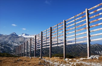 Avalanche barrier with view to the Hoher Dachstein