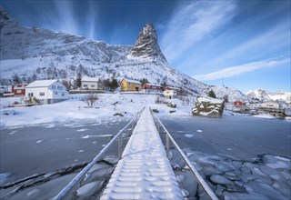 Pedestrian bridge over frozen fjord