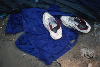 Sports shoes in front of a tent