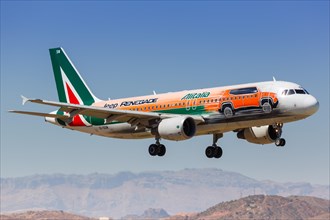 An Alitalia Airbus A320 with the registration EI-DSW in the Jeep Renegade special painting lands at Malaga Airport