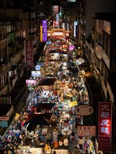 Busy pedestrian area at night