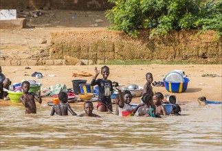 Children washing and playing Niger river