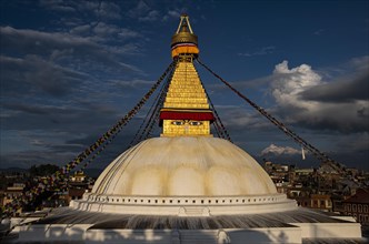 Boudha Stupa with the all-seeing eyes of Buddha in the evening light