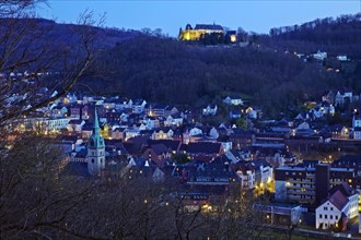 Hohenlimburg with the illuminated castle in the evening