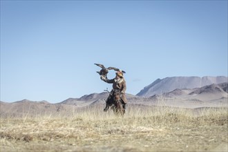 Spai Bashakan trains his female eagle
