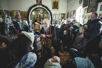 Father Sergei during an exorcism in his church in Ochamchira