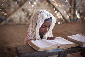 Girl reading in a madrasah