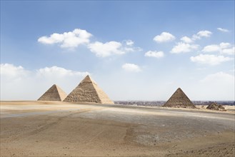 The three main pyramids with Cairo in the background
