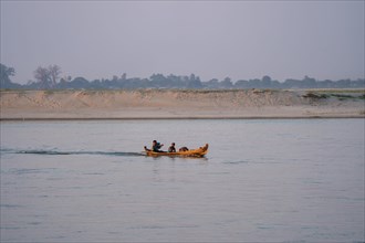 Boat with people goes on Irrawaddy River