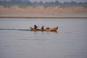 Boat with people goes on Irrawaddy River