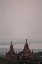 Two identical temples near the Irrawaddy River