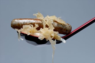Nuremberg grilled sausages with sauerkraut on kellet