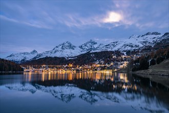 St. Moritz reflected in the St. Moritz lake at dusk