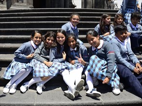 Girls in school uniform on the steps of the cathedral